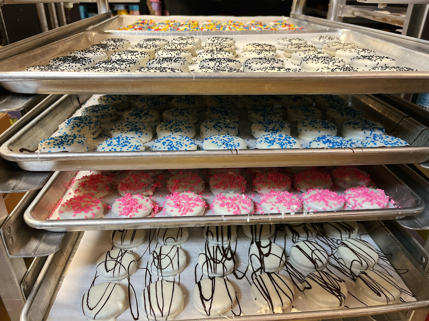 Trays of Oreos Dipped in Chocolate topped with colorful sprinkles and drizzles, perfect for festive dessert bars and holiday celebrations.