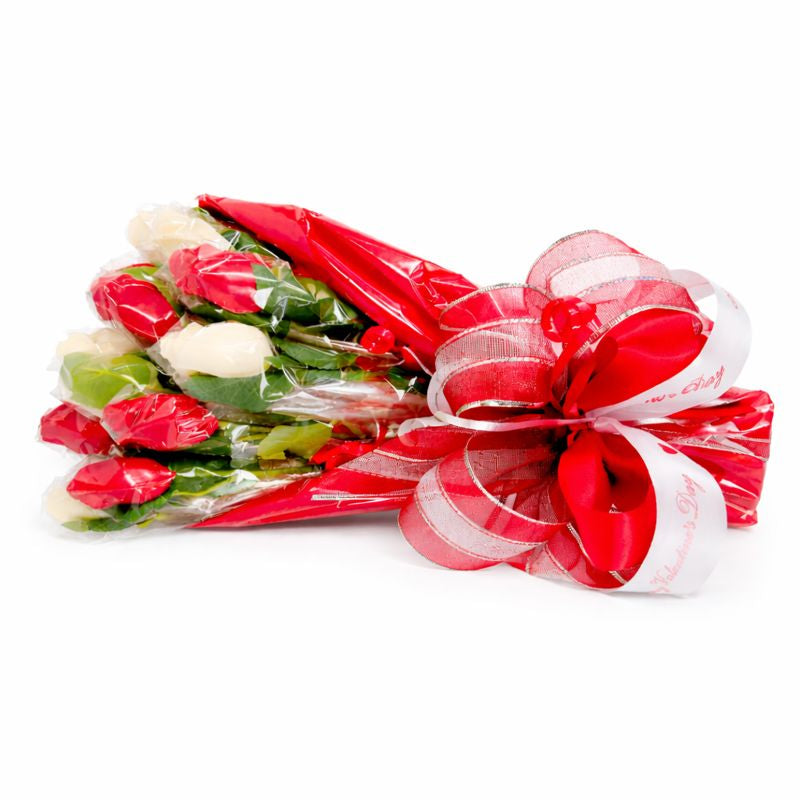 Bouquet of red and white flowers wrapped in cellophane with a decorative bow wrapped with ribbon, handcrafted gift, The Sweet Tooth North Miami Beach since 1979