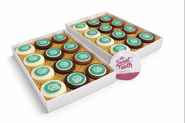 Two boxes of assorted chocolate dipped oreos with branded company logo edible