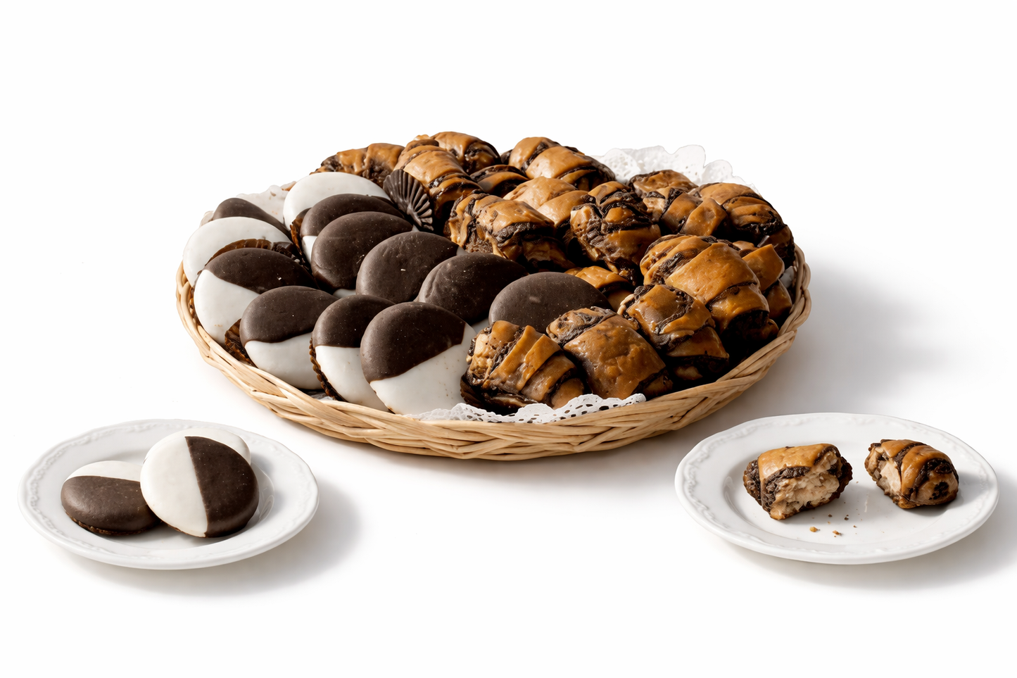 A wicker basket filled with Sonnny's famous black & white cookies with chocolate rugelach, arranged on a clean white studio background. A mix of soft cookies and rich pastry pieces ready for gifting or sharing.