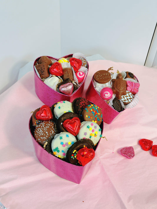 Heart-shaped chocolate gift boxes from The Sweet Tooth North Miami Beach, handmade since 1979, perfect for Valentine's Day