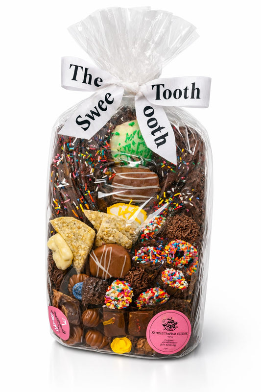 Gluten-free chocolate-dipped Oreos, pretzels, and chocolate bark arranged on a gift tray