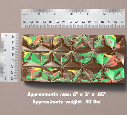 Passover Dubai Chocolate Bar with marbled design shown next to rulers for scale, measuring 6 x 3 x 0.85 inches and weighing 0.47 lbs.