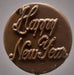 Chocolate candy with 'Happy New Year' text on a gray background