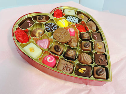 Heart-Shaped Box of Chocolates & Truffles filled with assorted gourmet treats including chocolate-covered fruit, ideal for gifting.