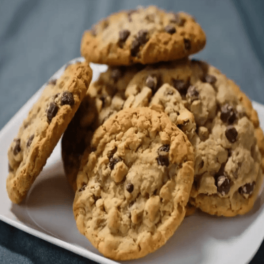 Sweet Tooth Cookies with soft-chewy centers and crisp edges, fresh-baked and kosher certified, arranged for gifting.”