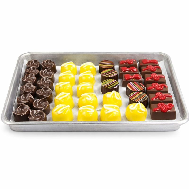 Assorted chocolates on tray + handcrafted decorated assortment + The Sweet Tooth North Miami Beach + since 1979