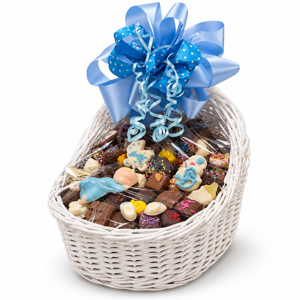 Baby boy bassinet chocolate gift basket by The Sweet Tooth, with assorted chocolates in a white wicker basket and blue bow.
