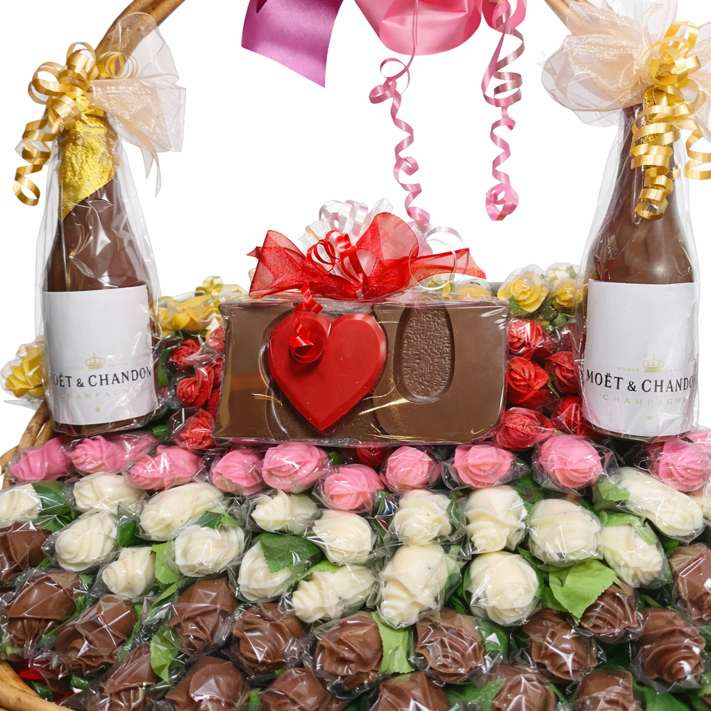 Chocolate gift basket with chocolate champagne bottles and assorted chocolate roses The Sweet Tooth