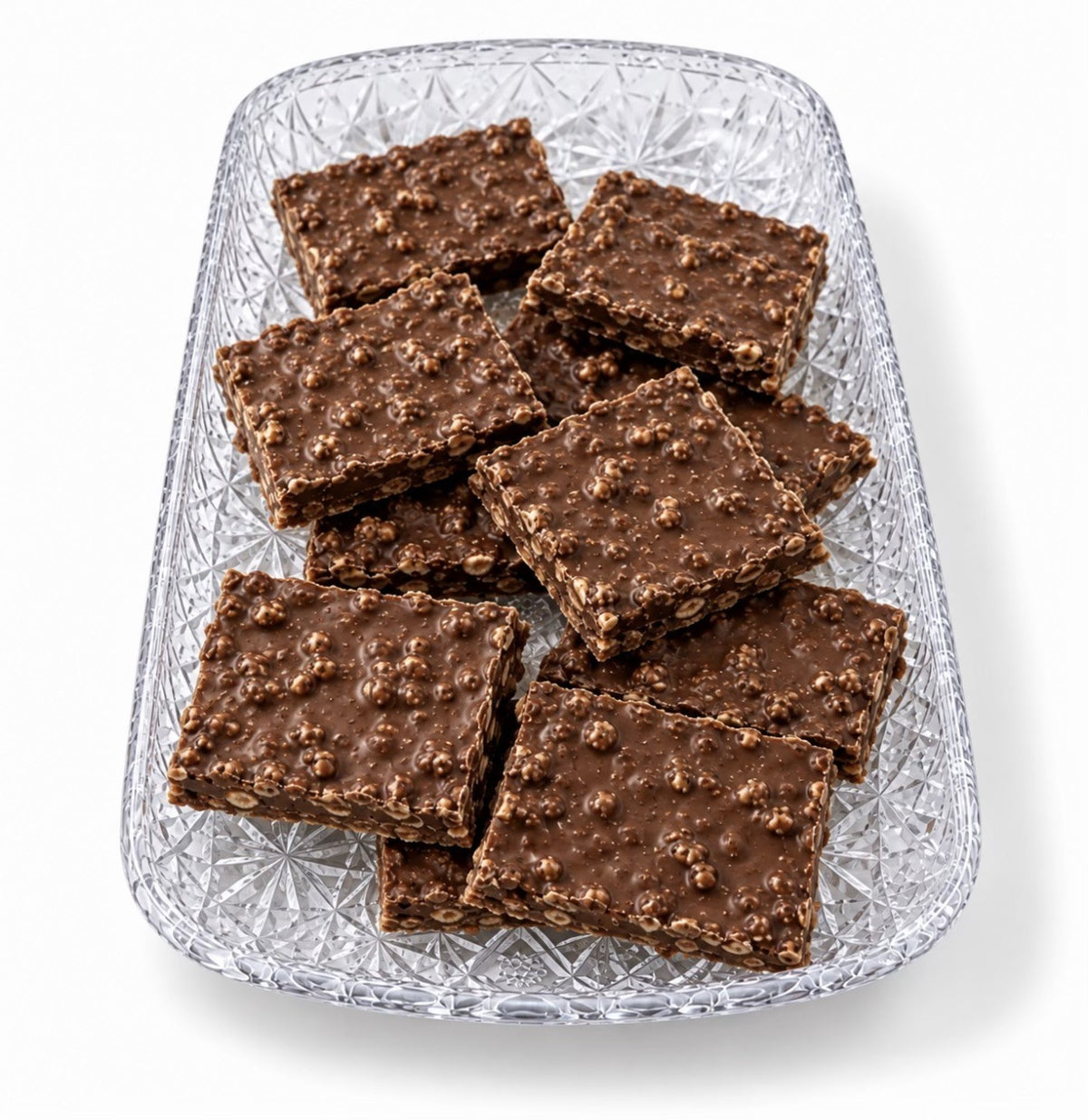 Chocolate Krisp bark with crisp rice on a glass tray