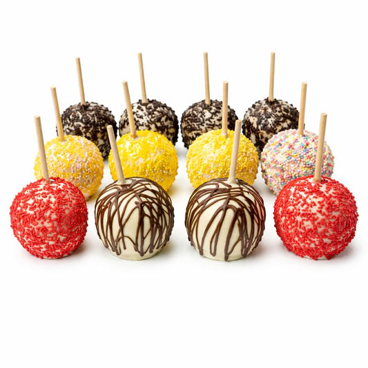 Assorted colorfull chocolate covered apples on sticks against a white background