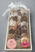 Box of gluten-free treats with sprinkles and a visible brand label on a gray background