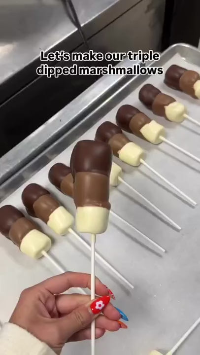 Chocolate-dipped marshmallow sticks being made at The Sweet Tooth