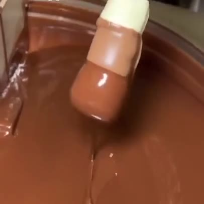 Chocolate-dipped marshmallow sticks being made at The Sweet Tooth