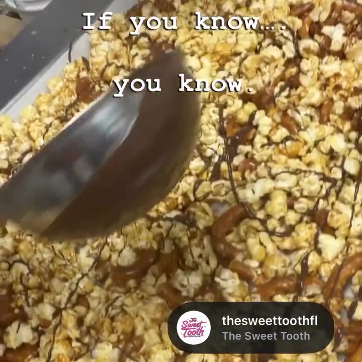 Mucho Gusto Munch being drizzled with chocolate at our factory