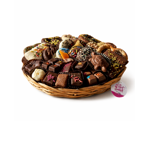 Assorted chocolates in a wicker basket on a white background